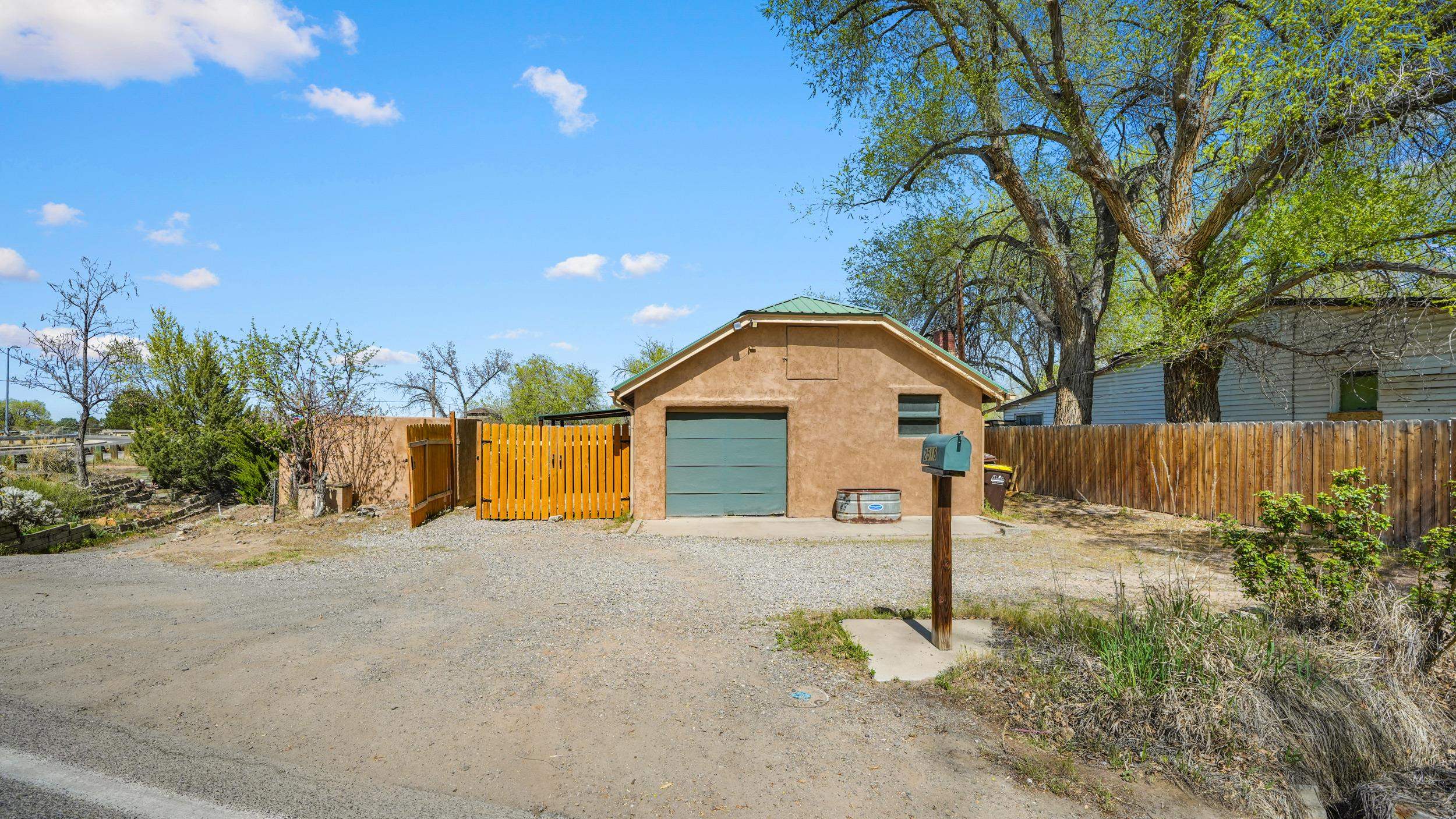 2518 D Road Grand Junction, CO 81507 - Photo 38 of 42 a front view of a house with a yard and garage