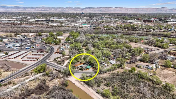 an aerial view of a house with a swimming pool and a garden