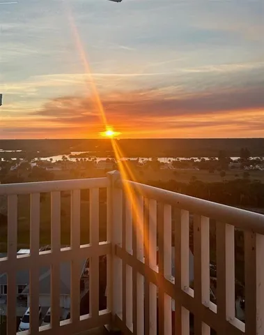 a view of a balcony with an ocean