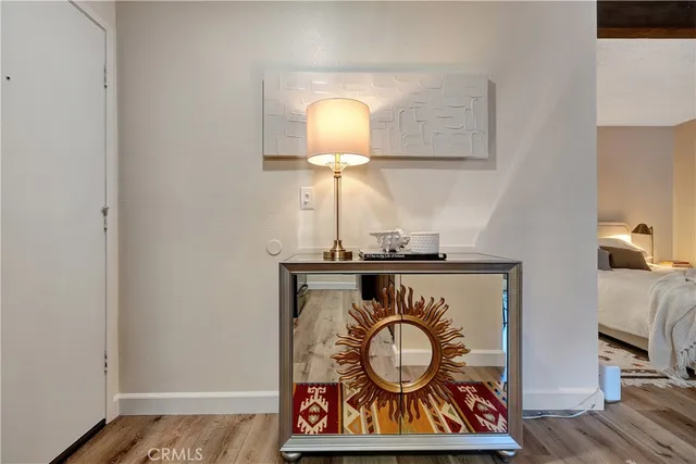 a view of light fixtures and wooden floor