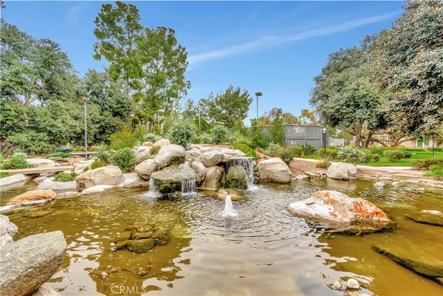 a view of a lake with furniture