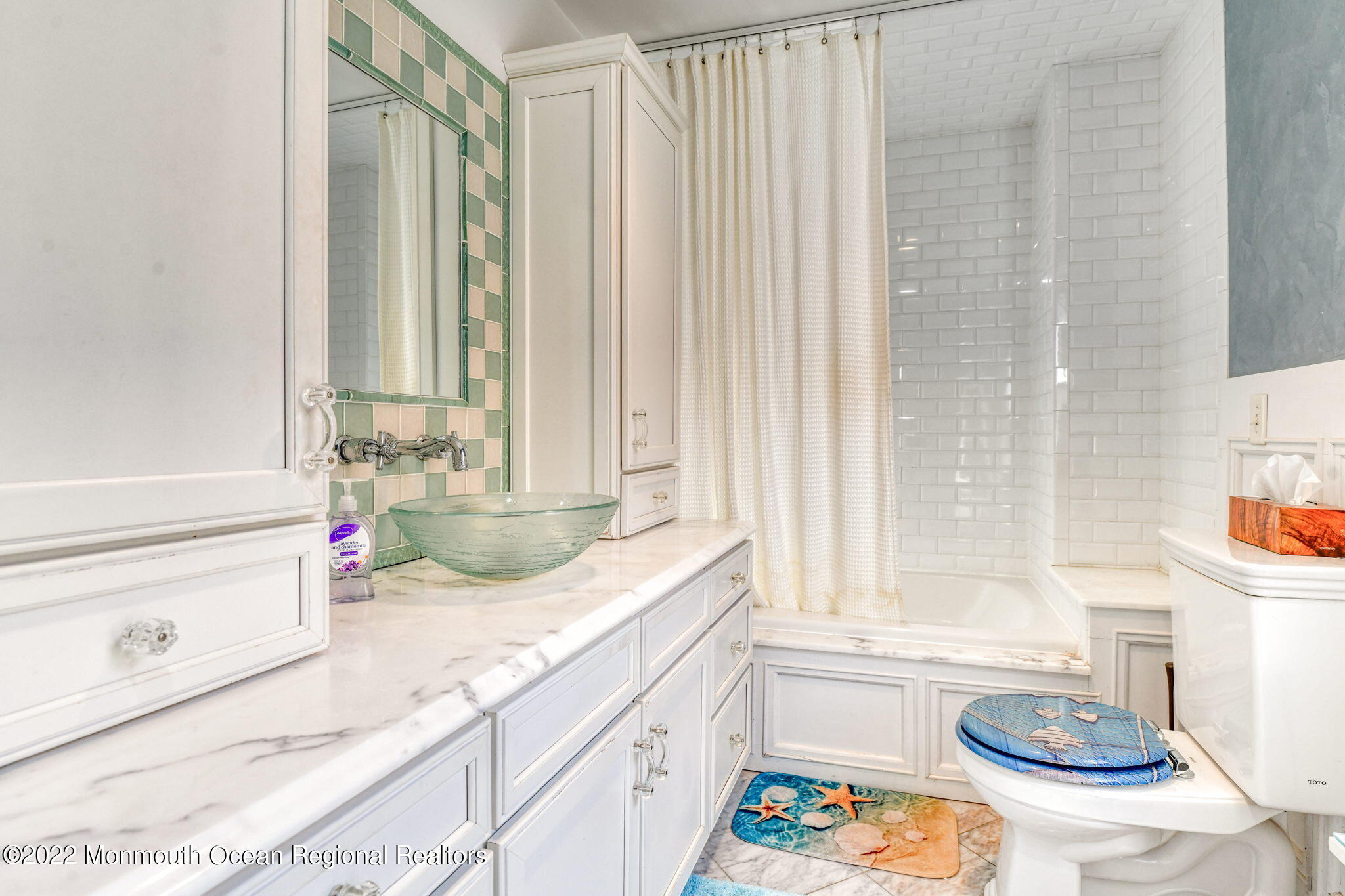 8 Surf Avenue, Unit 1 Ocean Grove, NJ 07756 - Photo 11 of 28 a bathroom with a granite countertop sink and a large mirror