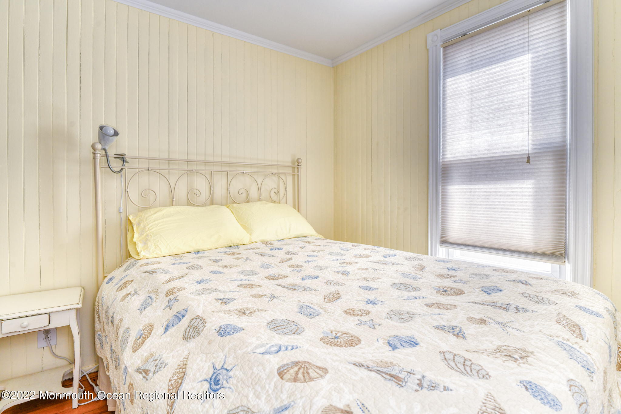 8 Surf Avenue, Unit 1 Ocean Grove, NJ 07756 - Photo 14 of 28 a bedroom with a bed and a window