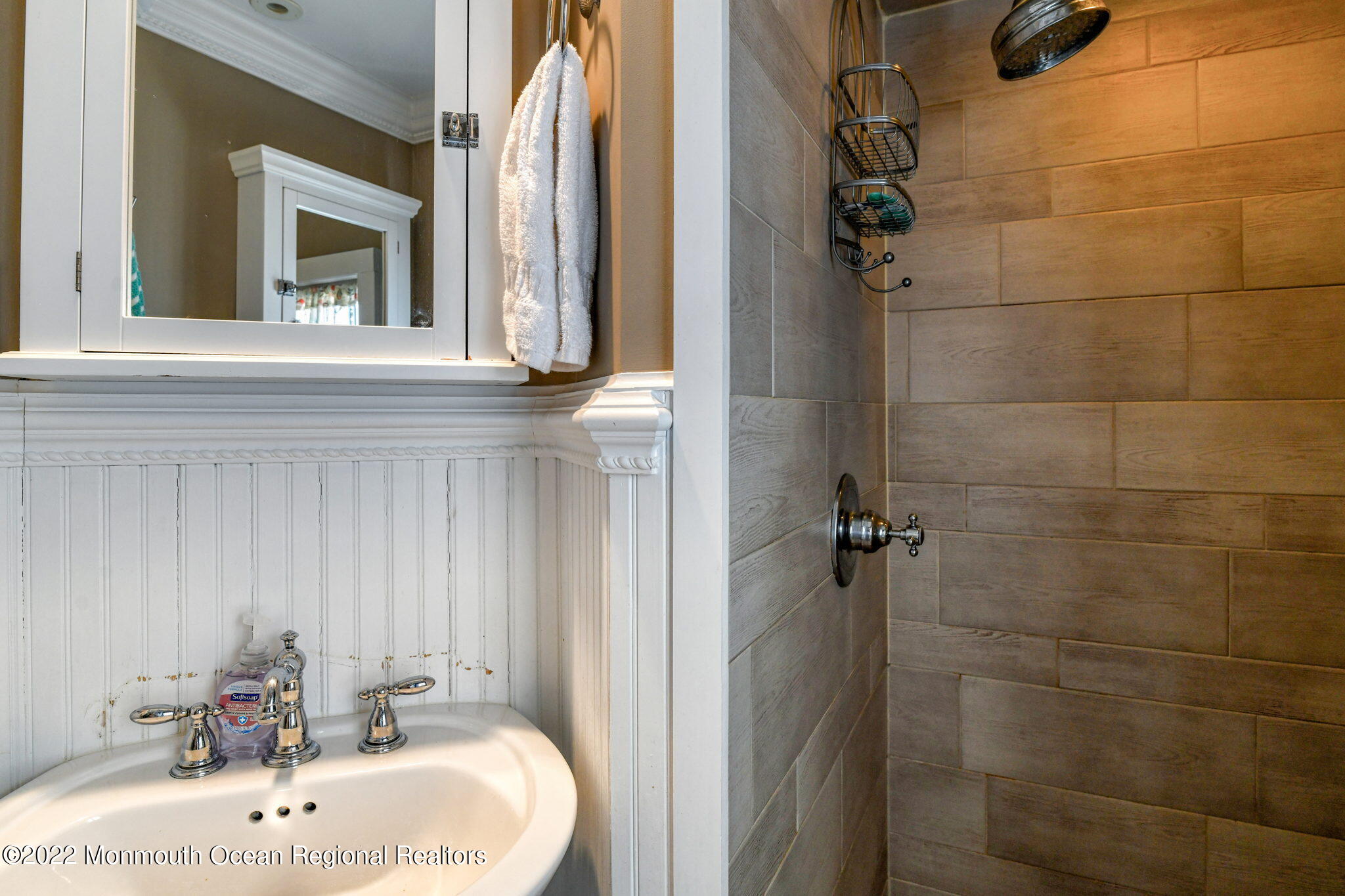8 Surf Avenue, Unit 1 Ocean Grove, NJ 07756 - Photo 15 of 28 a bathroom with a sink a toilet and shower