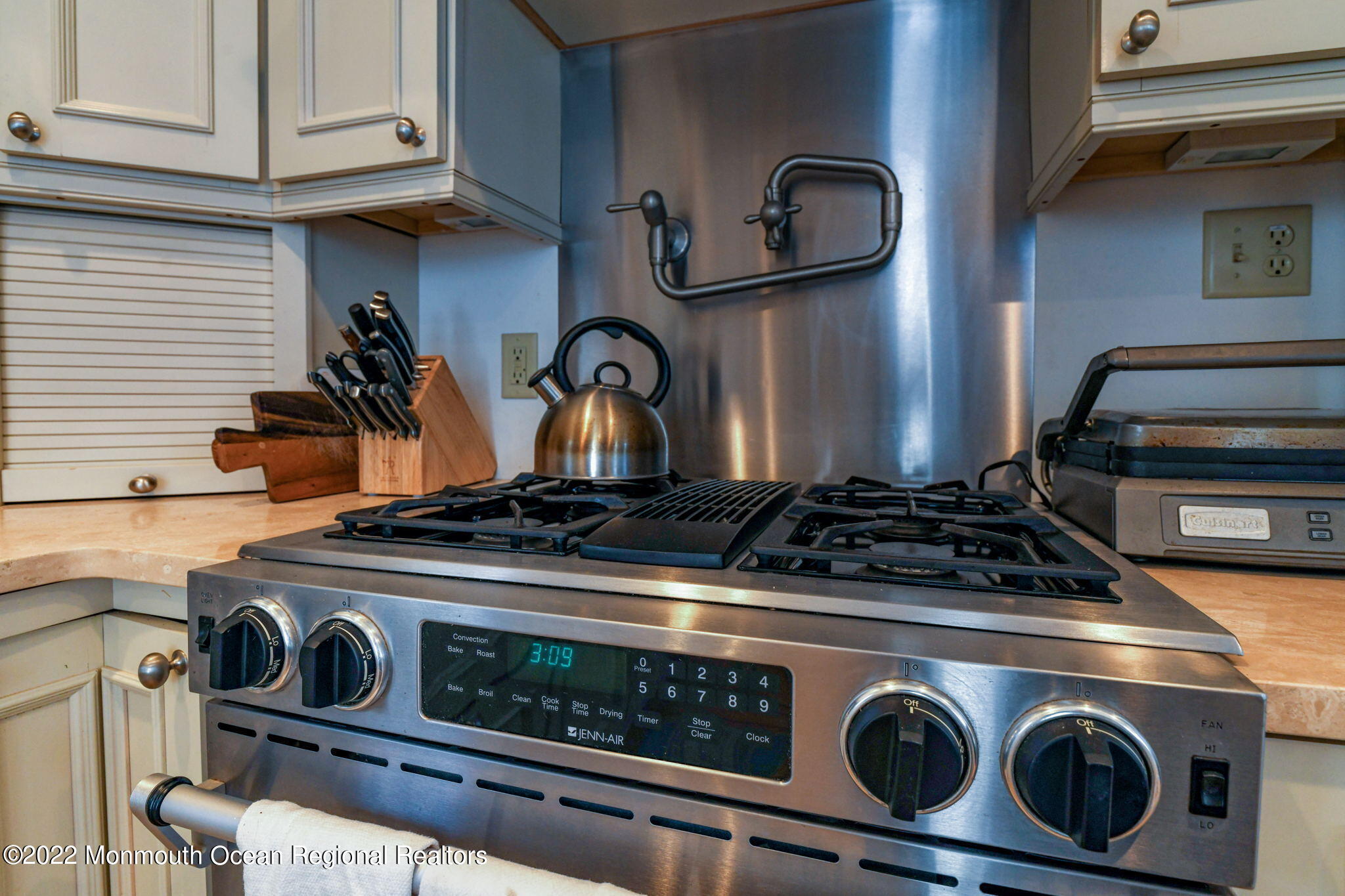 8 Surf Avenue, Unit 1 Ocean Grove, NJ 07756 - Photo 20 of 28 a stove top oven sitting inside of a kitchen