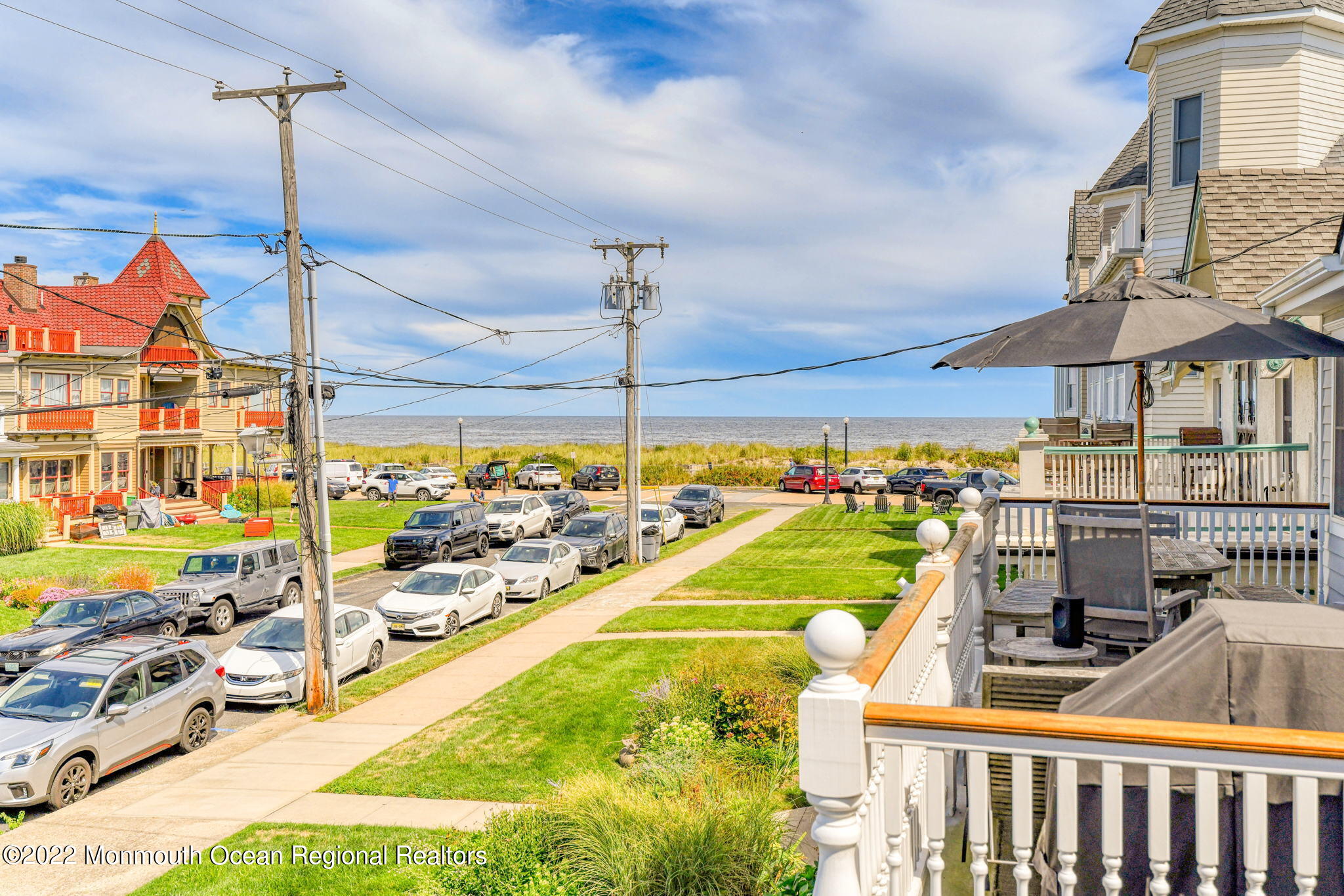 8 Surf Avenue, Unit 1 Ocean Grove, NJ 07756 - Photo 25 of 28 a view of a swimming pool with a lounge chairs