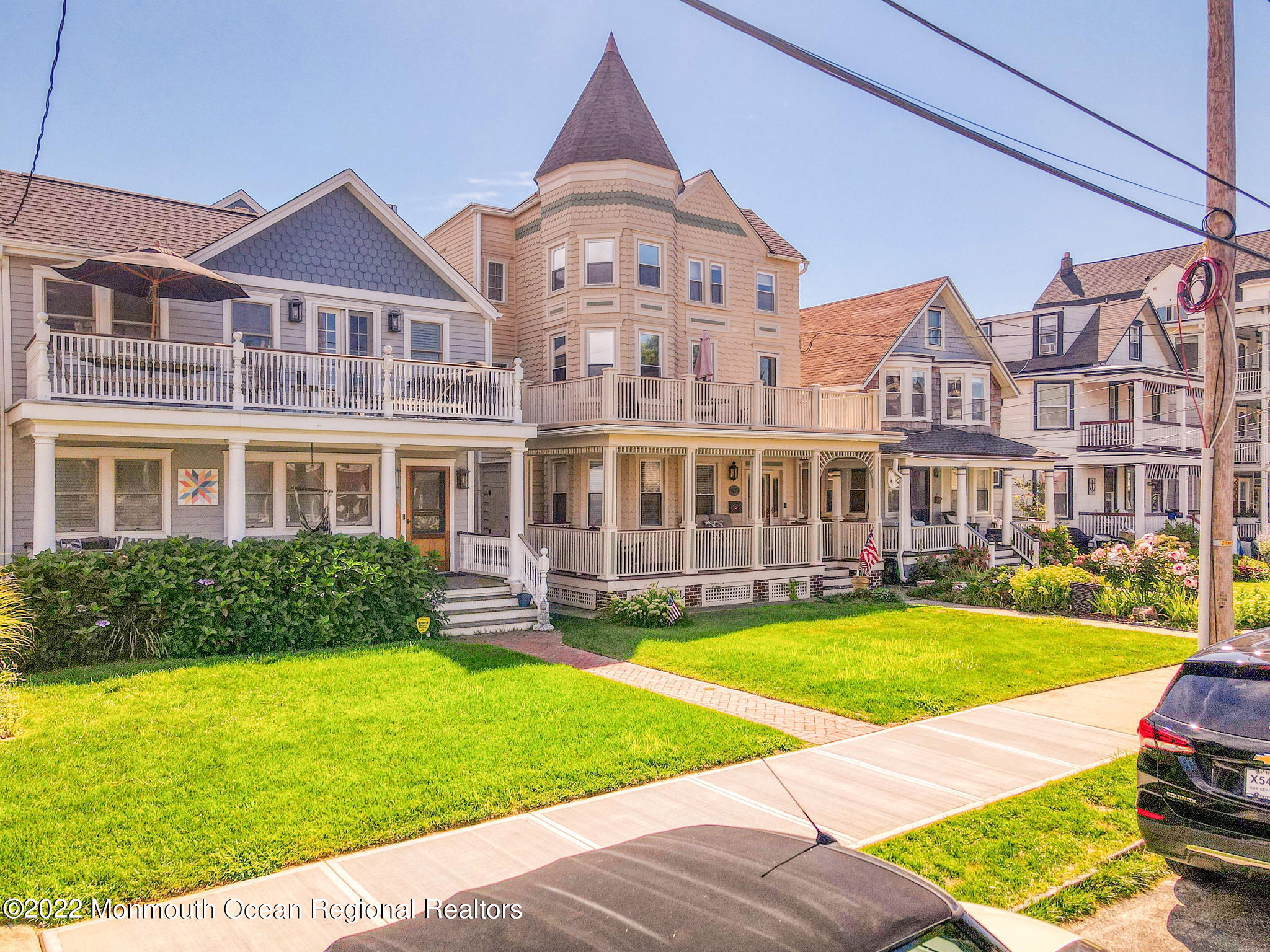 8 Surf Avenue, Unit 1 Ocean Grove, NJ 07756 - Photo 26 of 28 a front view of a house with a yard