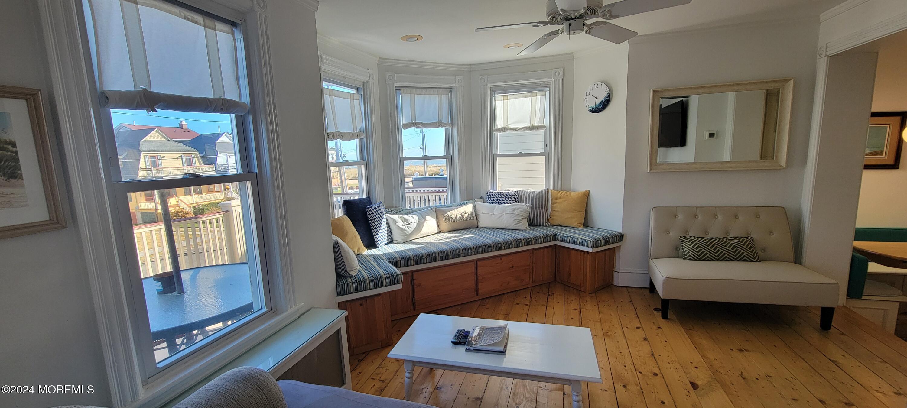 8 Surf Avenue, Unit 1 Ocean Grove, NJ 07756 - Photo 5 of 28 a living room with furniture and a fireplace