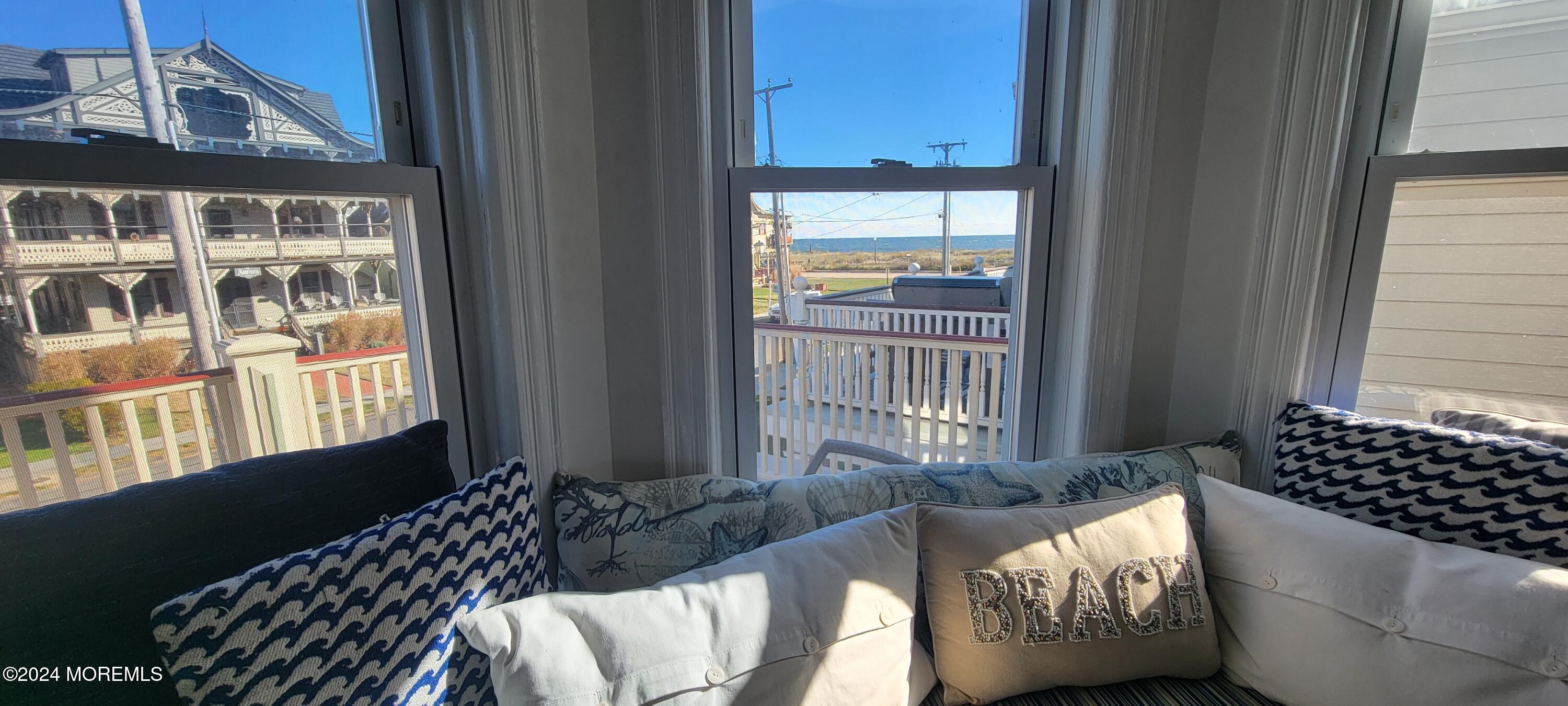 8 Surf Avenue, Unit 1 Ocean Grove, NJ 07756 - Photo 7 of 28 a living room with furniture and a window