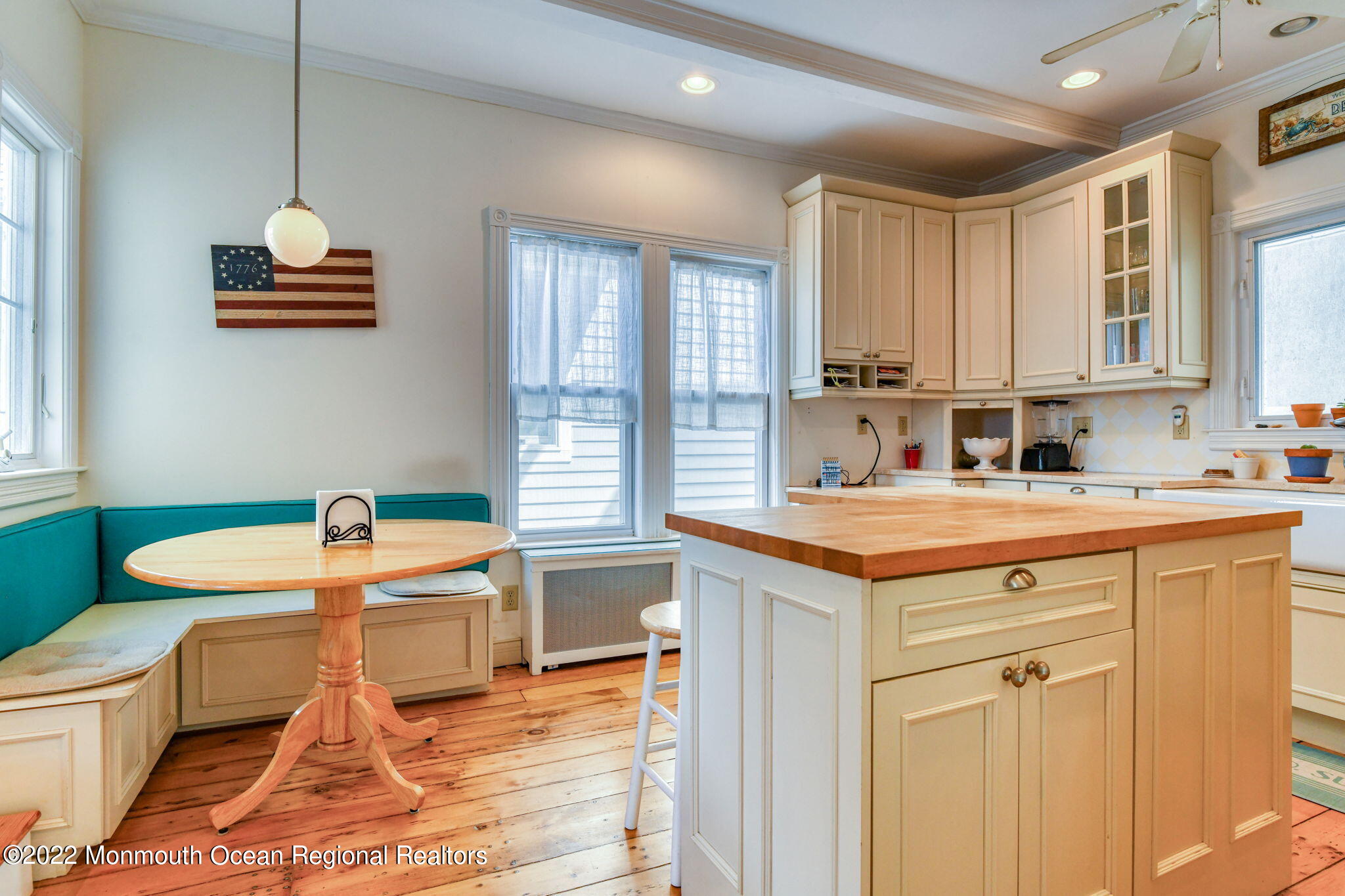 8 Surf Avenue, Unit 1 Ocean Grove, NJ 07756 - Photo 8 of 28 a kitchen with a sink cabinets and wooden floor