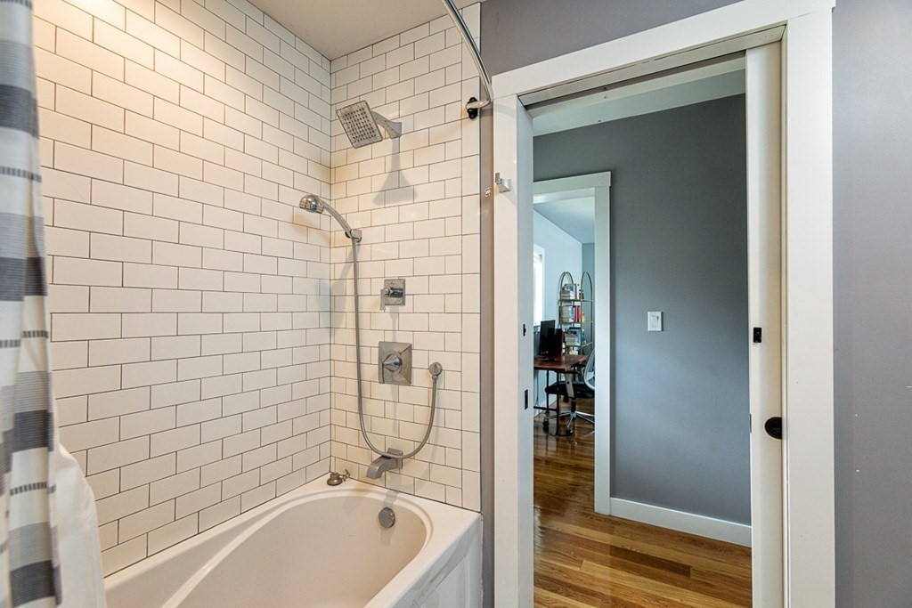 6 Twin Hills Farm Road, Unit 2 Rowley, MA 01969 - Photo 23 of 42 a bathroom with a bathtub and shower