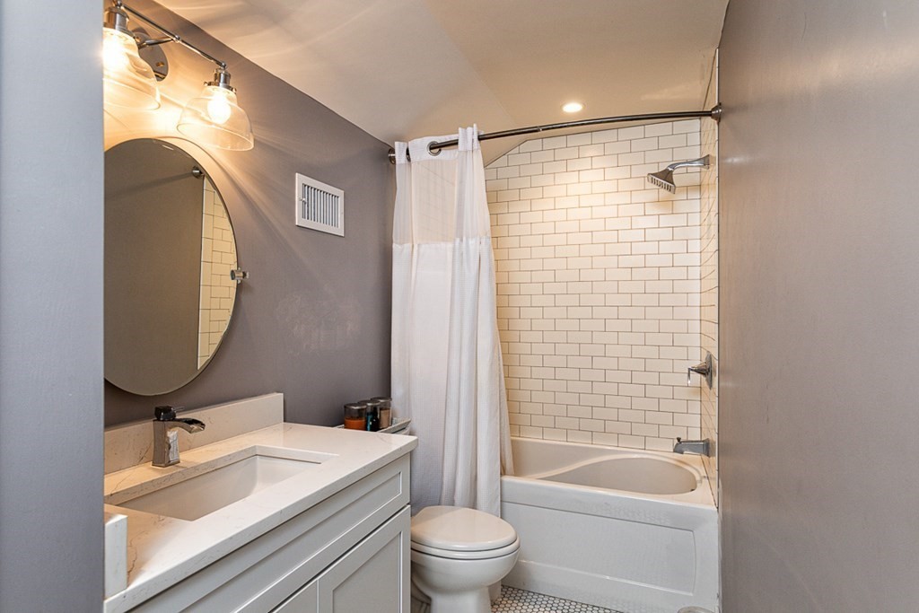 6 Twin Hills Farm Road, Unit 2 Rowley, MA 01969 - Photo 27 of 42 a bathroom with a sink toilet and shower