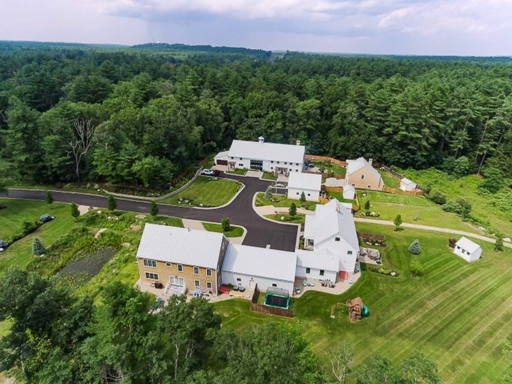 6 Twin Hills Farm Road, Unit 2 Rowley, MA 01969 - Photo 40 of 42 an aerial view of a house with garden space and street view
