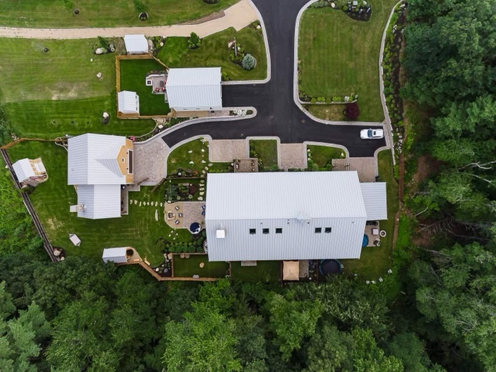 6 Twin Hills Farm Road, Unit 2 Rowley, MA 01969 - Photo 42 of 42 an aerial view of a house with swimming pool garden and tall trees