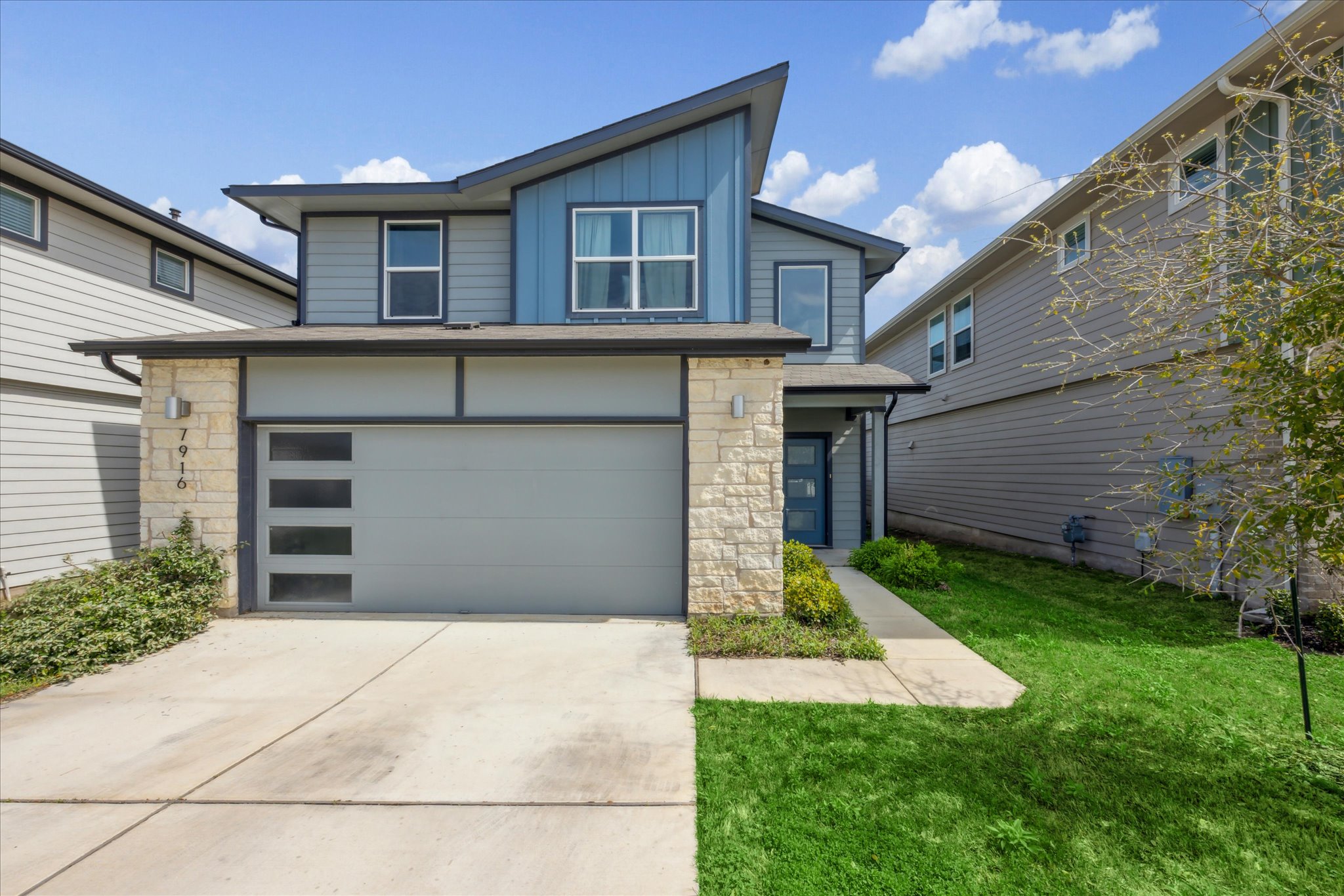 7916 Linnie Lane Austin, TX 78724 - Photo 1 of 14 a front view of a house with a yard and garage