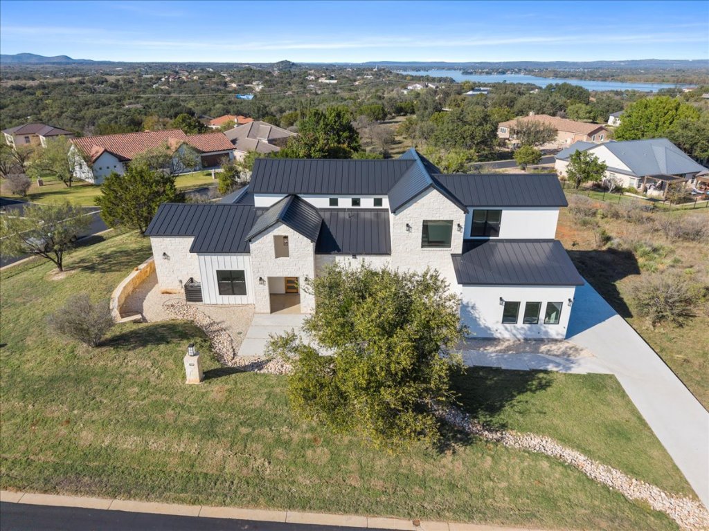 102 Mountain Home Road Horseshoe Bay, TX 78657 - Photo 2 of 32 an aerial view of residential houses with outdoor space and ocean