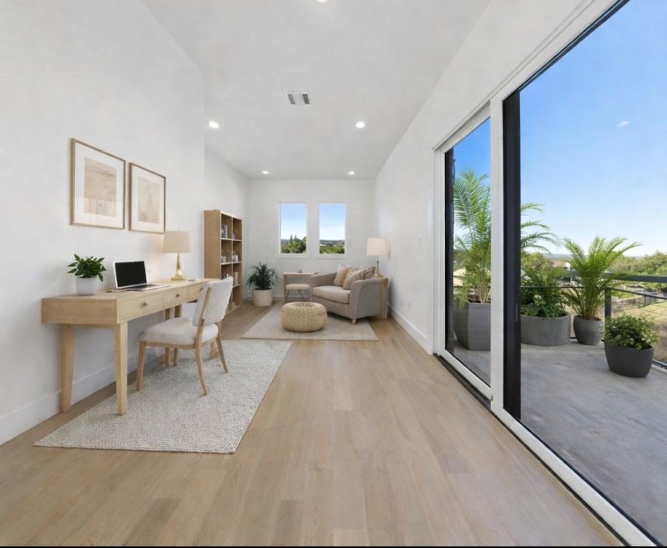 102 Mountain Home Road Horseshoe Bay, TX 78657 - Photo 22 of 32 a living room with furniture a potted plant and a table