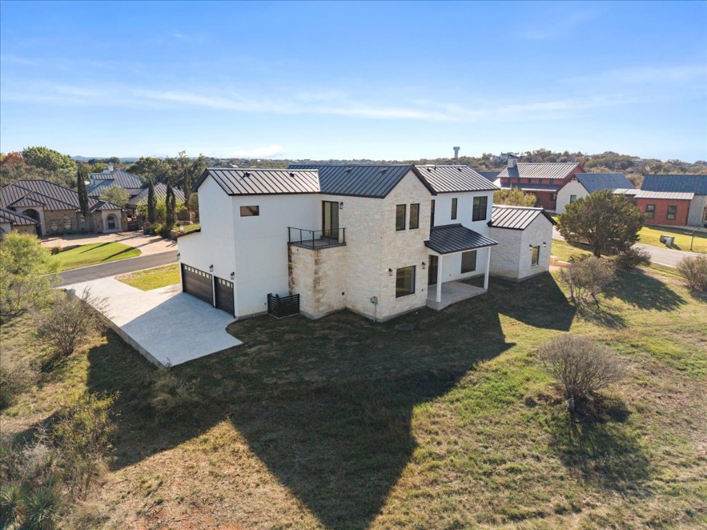 102 Mountain Home Road Horseshoe Bay, TX 78657 - Photo 31 of 32 an aerial view of a house with a yard big trees