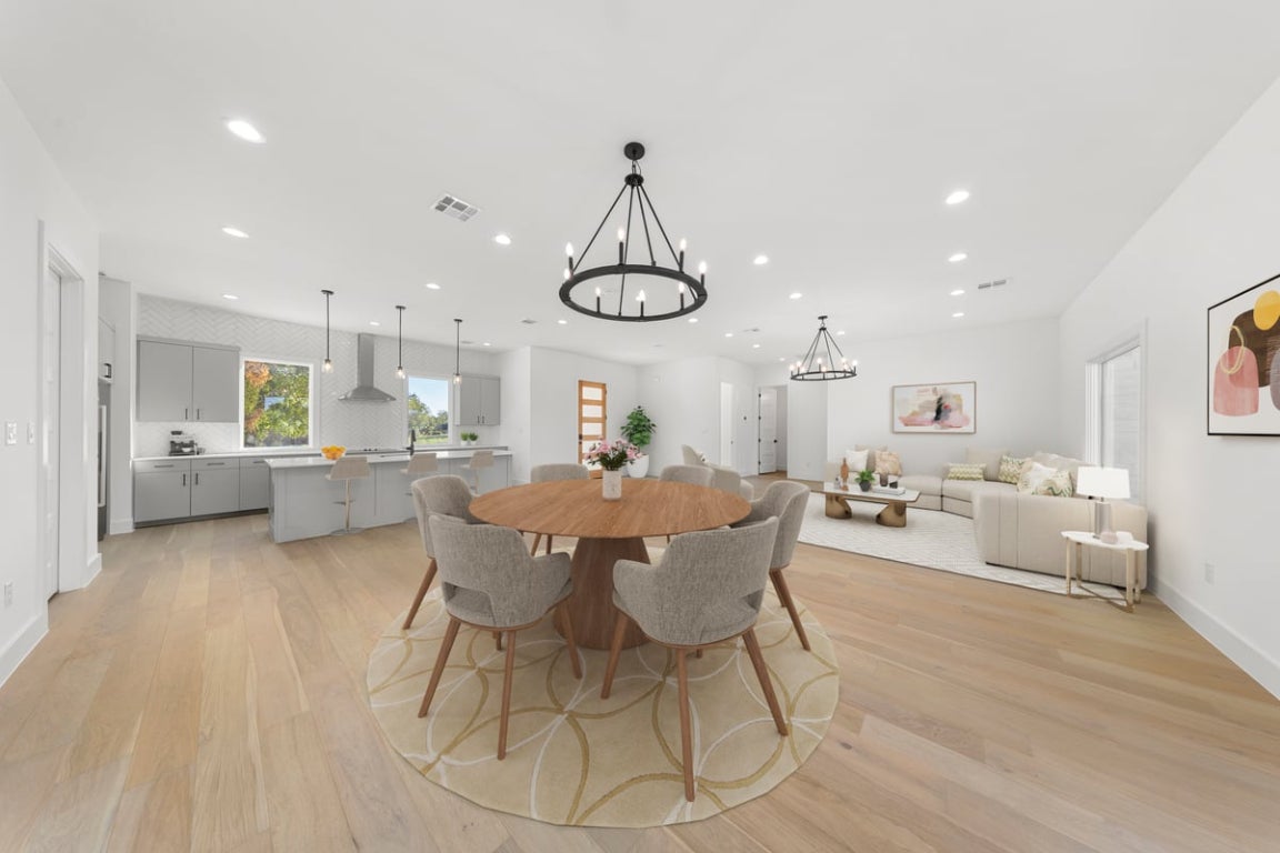102 Mountain Home Road Horseshoe Bay, TX 78657 - Photo 4 of 32 a view of a dining room with furniture window and wooden floor