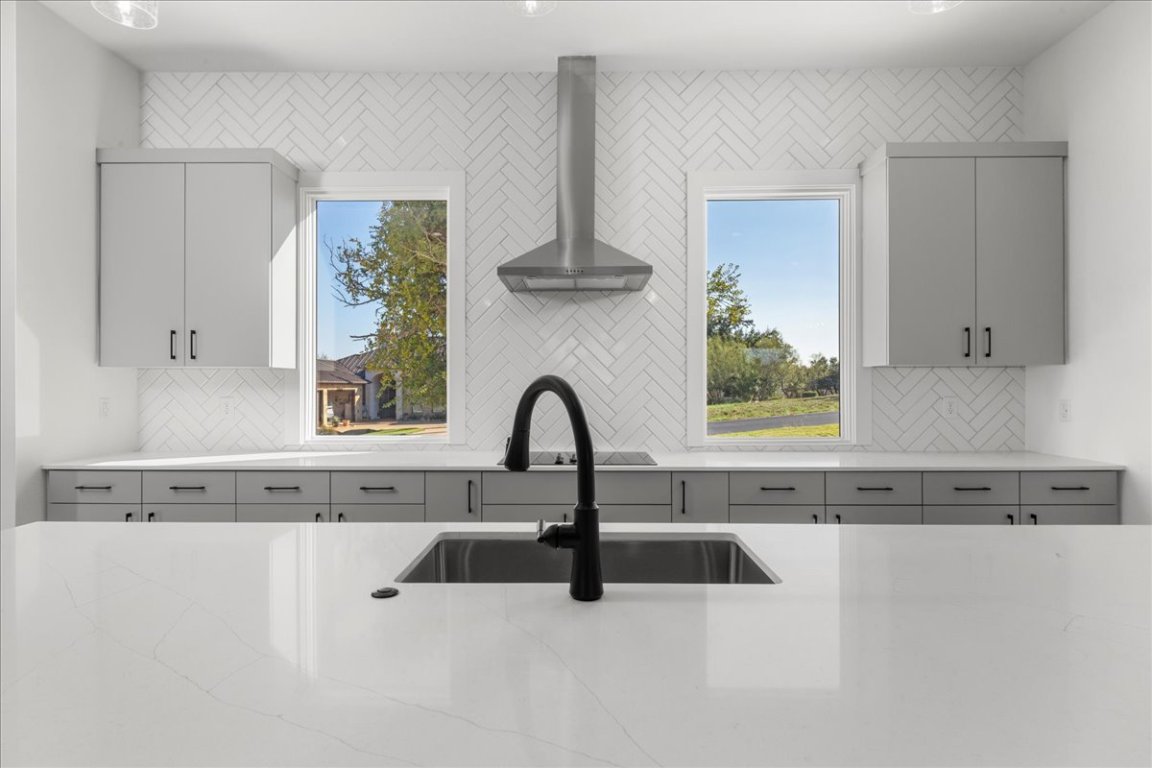 102 Mountain Home Road Horseshoe Bay, TX 78657 - Photo 10 of 32 a view of a kitchen with a sink and a window