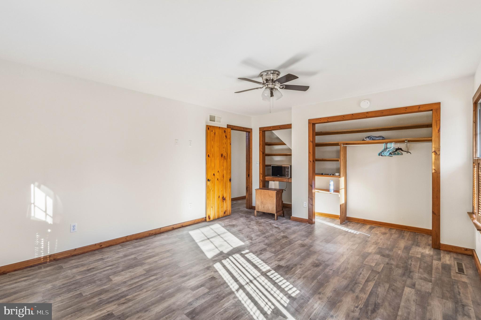 19268 Deerfield Road Bridgeville, DE 19933 - Photo 11 of 33 a view of empty room with wooden floor and fan