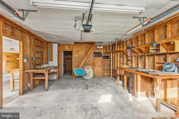 a view of a chairs and table in a backyard