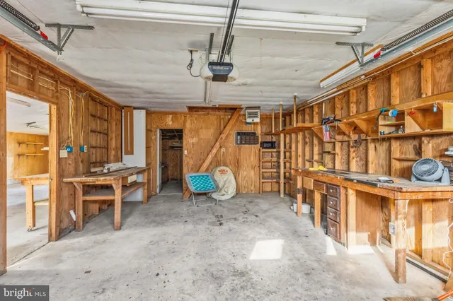 a view of a chairs and table in a backyard