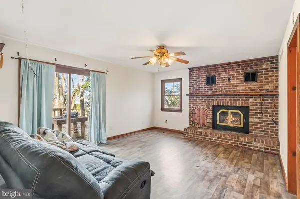 a bedroom with a bed and a fireplace