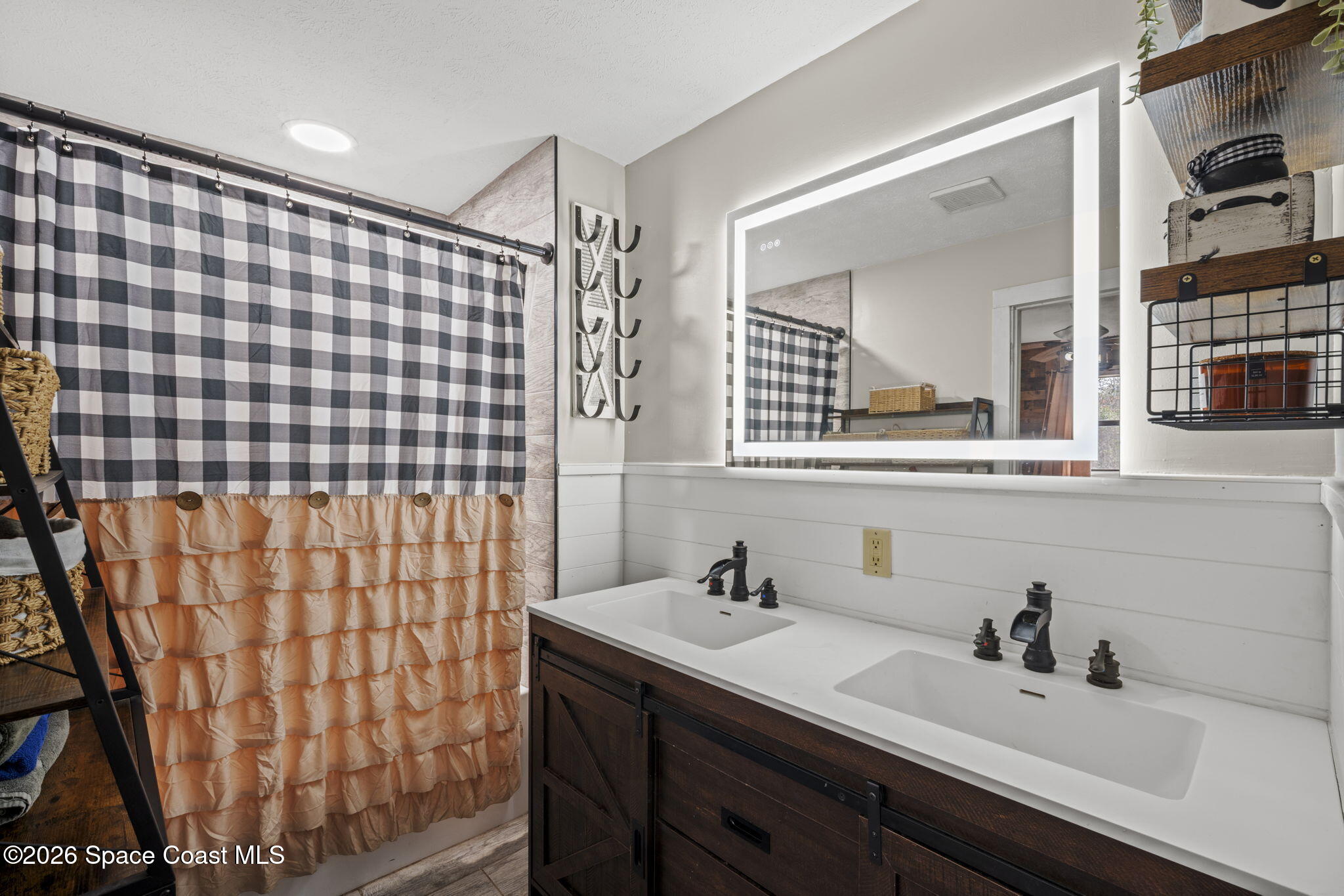 3416 Flounder Creek Road Mims, FL 32754 - Photo 23 of 42 a bathroom with a sink and a mirror