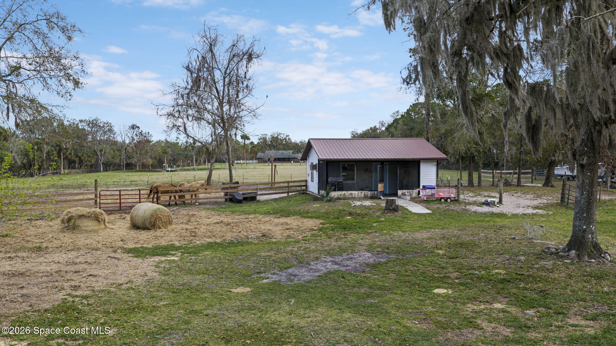 3416 Flounder Creek Road Mims, FL 32754 - Photo 30 of 42 a view of a house with backyard and sitting area
