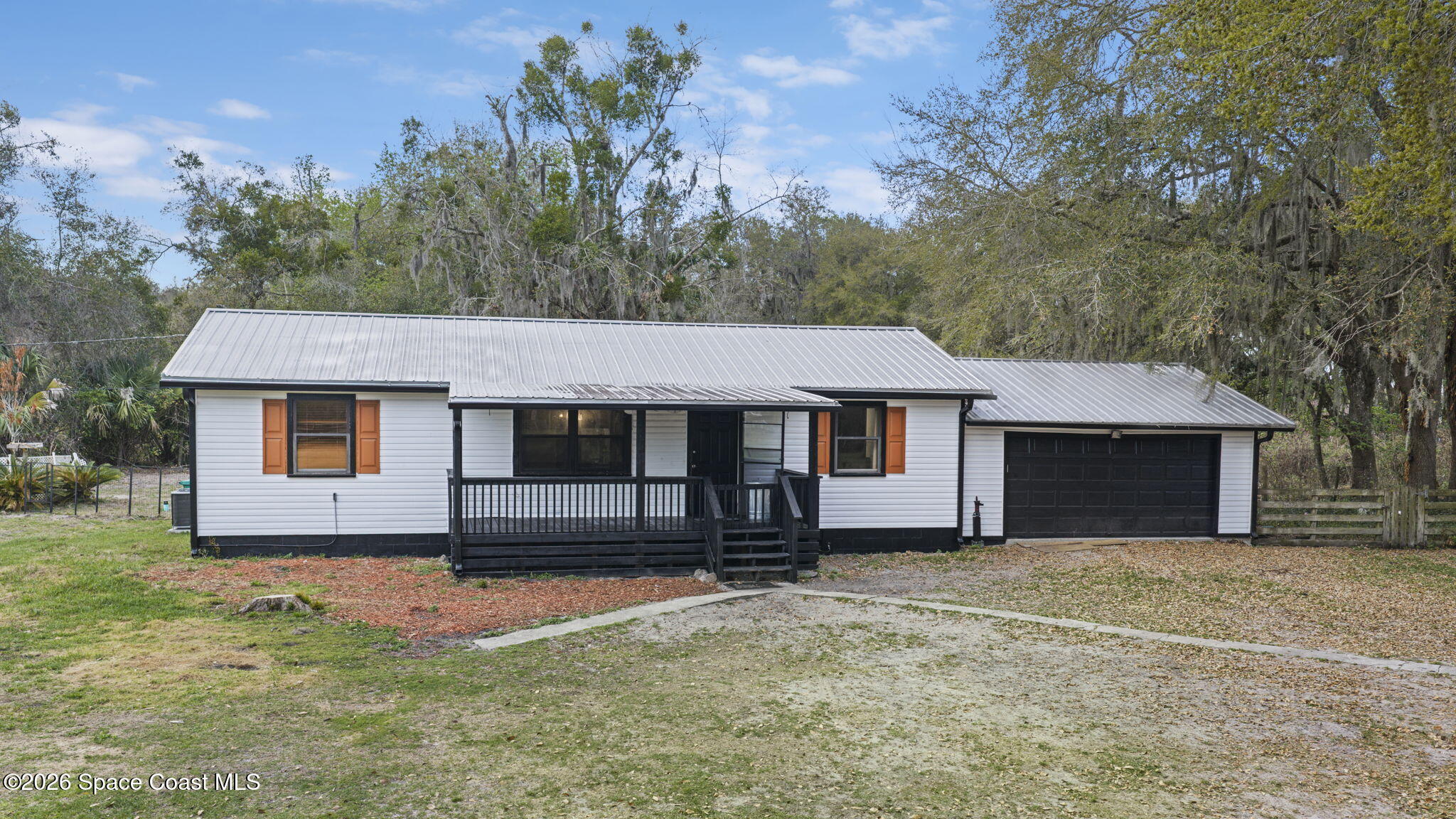 3416 Flounder Creek Road Mims, FL 32754 - Photo 3 of 42 front view of a house with a yard