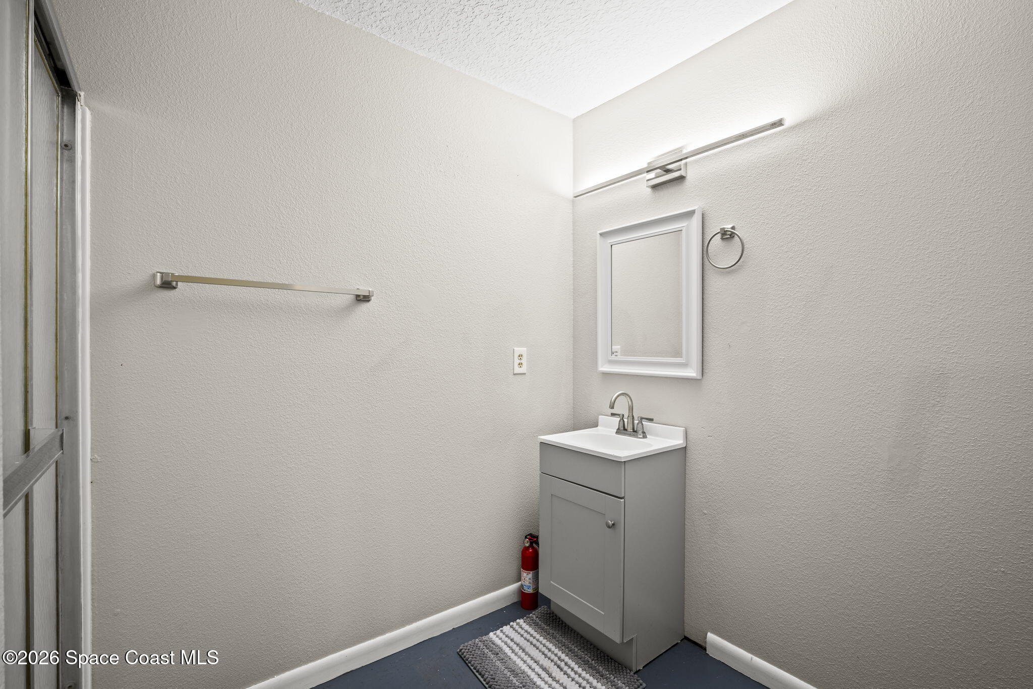 3416 Flounder Creek Road Mims, FL 32754 - Photo 35 of 42 a bathroom with a sink toilet and mirror