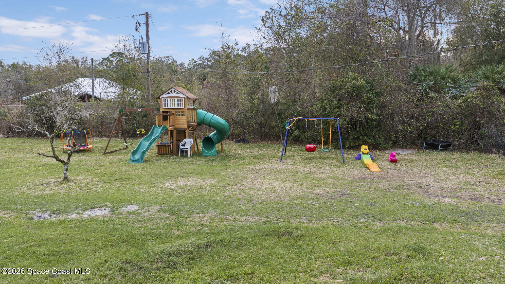 3416 Flounder Creek Road Mims, FL 32754 - Photo 39 of 42 a childrens park with lots of swings and slides