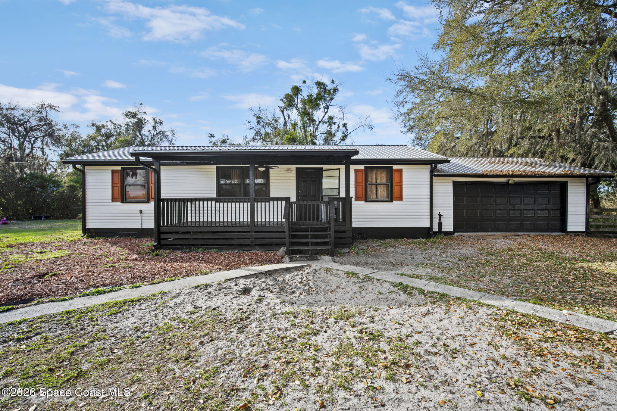 3416 Flounder Creek Road Mims, FL 32754 - Photo 4 of 42 front view of a house with a yard