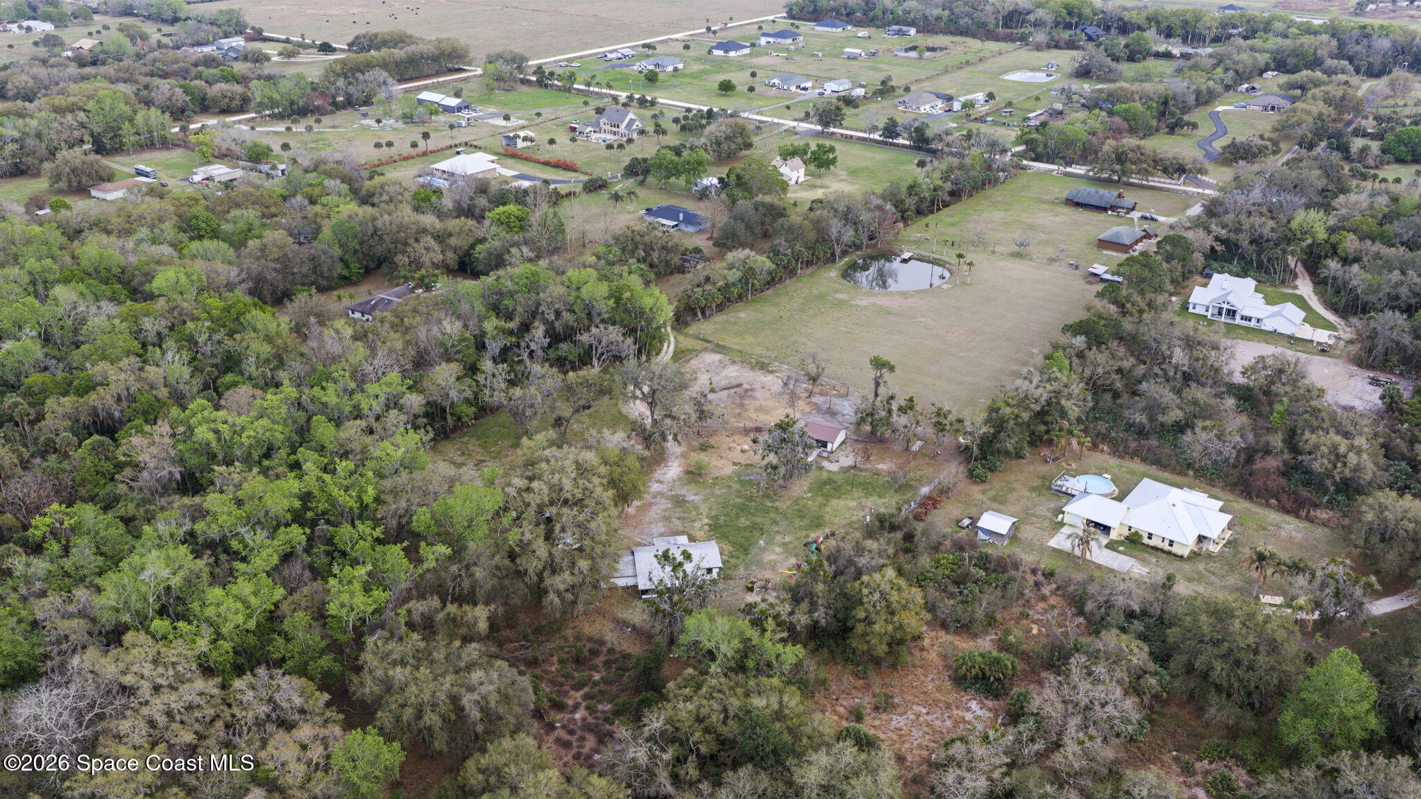 3416 Flounder Creek Road Mims, FL 32754 - Photo 41 of 42 an aerial view of a houses with a yard