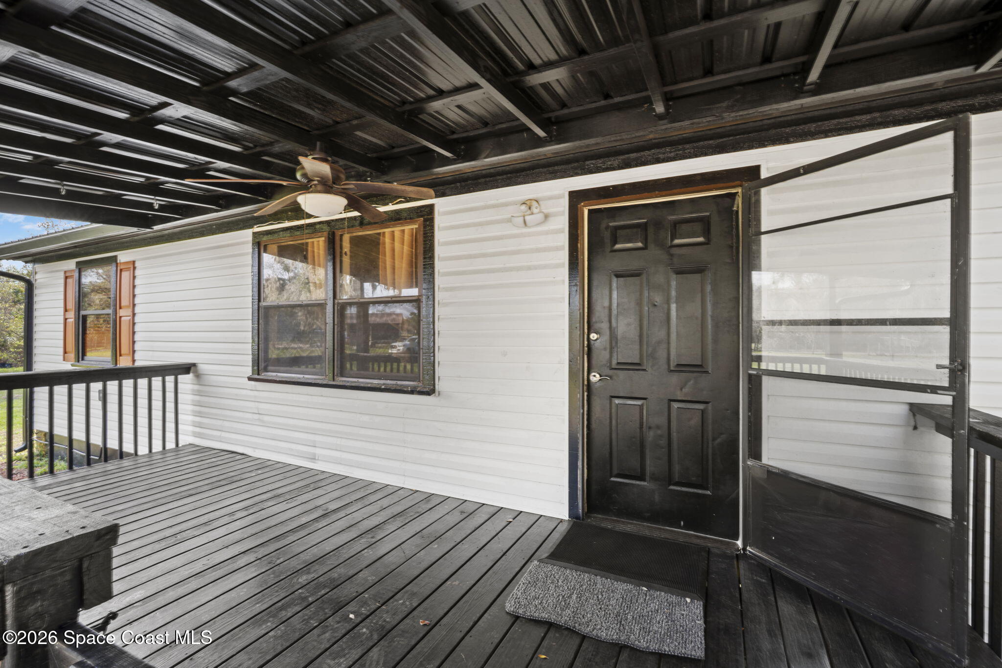 3416 Flounder Creek Road Mims, FL 32754 - Photo 5 of 42 a view of a house with wooden deck
