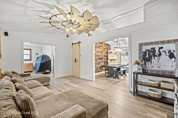 a view of a livingroom with furniture and window