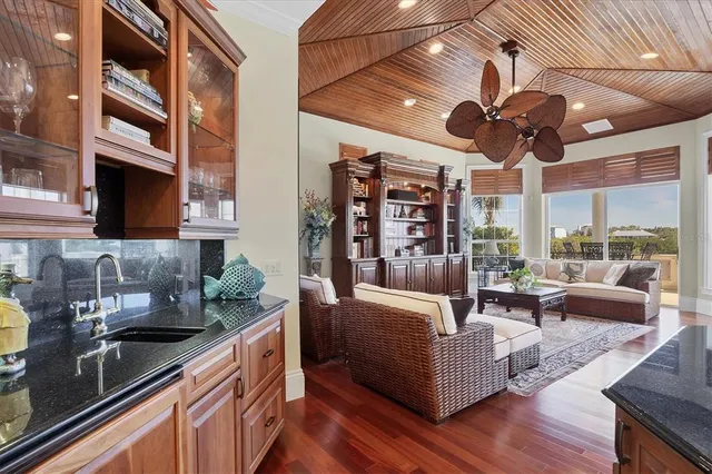 a kitchen with stainless steel appliances granite countertop a stove and a wooden floors