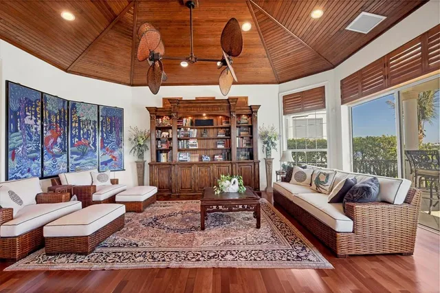 a spacious bedroom with a bed a couch and dresser