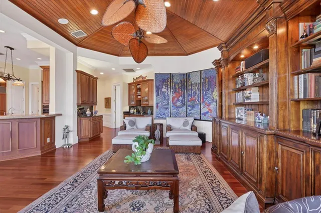 a bedroom with a bed and a large window with outer view