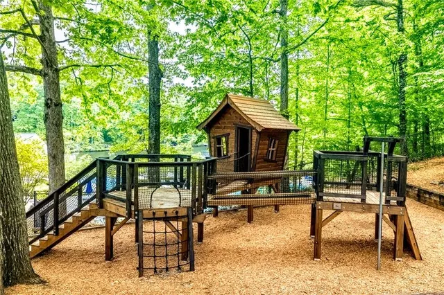an aerial view of a house with a yard and swimming pool