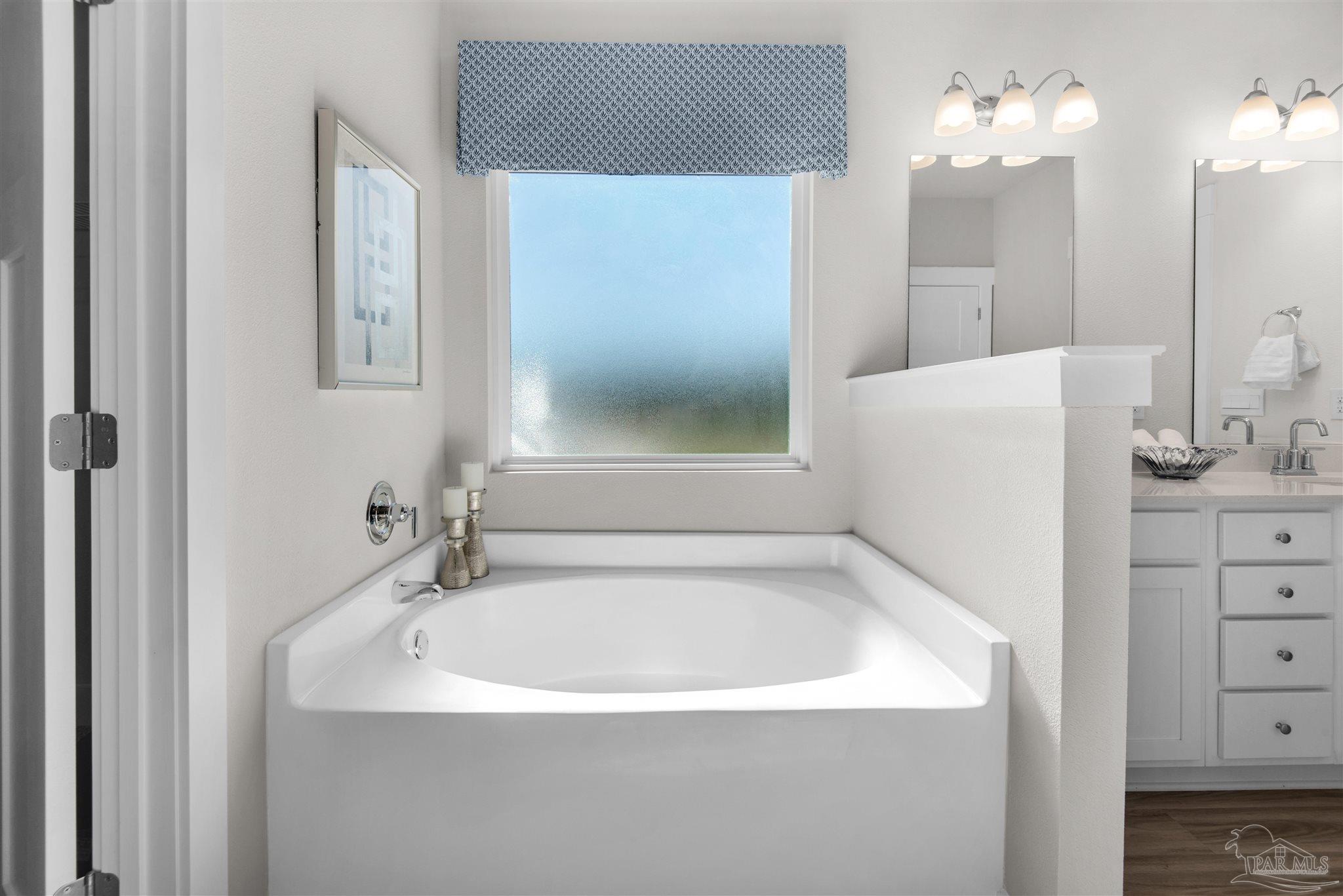 3411 Crossvine Road Cantonment, FL 32533 - Photo 36 of 45 a white bath tub sitting next to a white sink