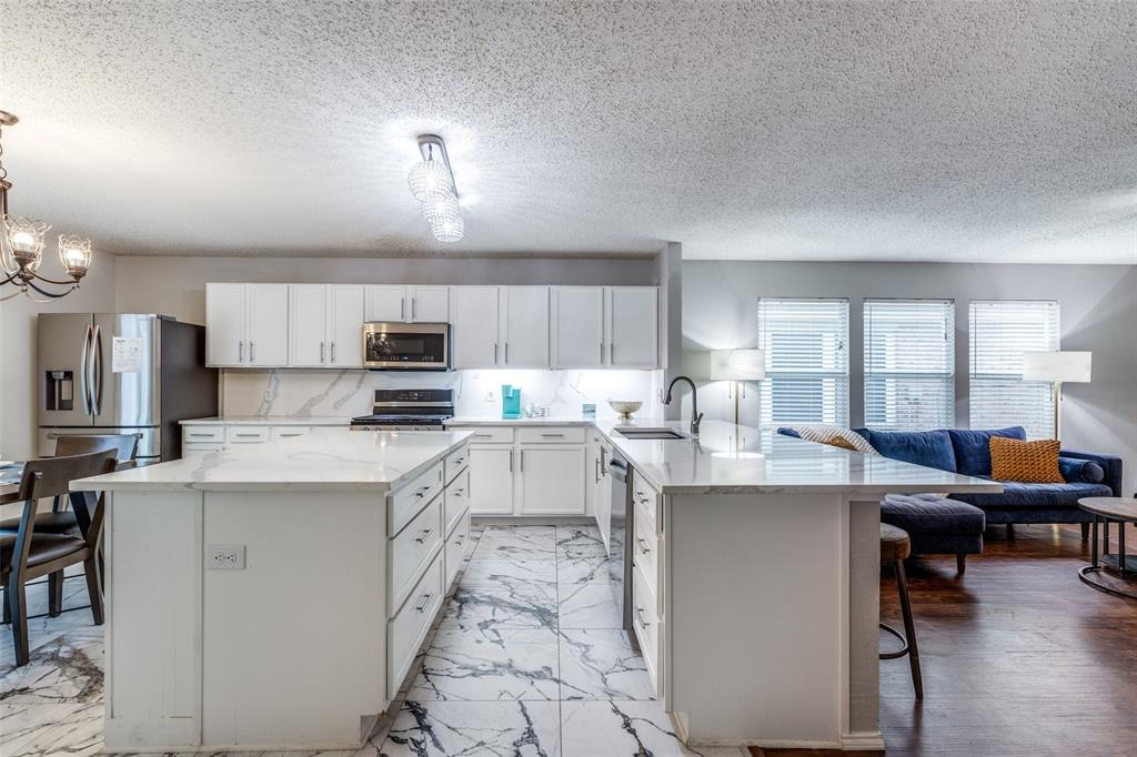 1425 Ridgecrest Drive Little Elm, TX 75068 - Photo 13 of 27 a kitchen with counter top space cabinets and appliances