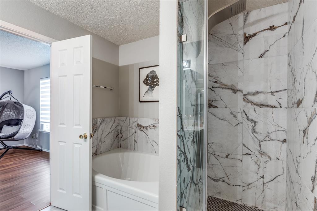 1425 Ridgecrest Drive Little Elm, TX 75068 - Photo 19 of 27 a bathroom with a bathtub and shower