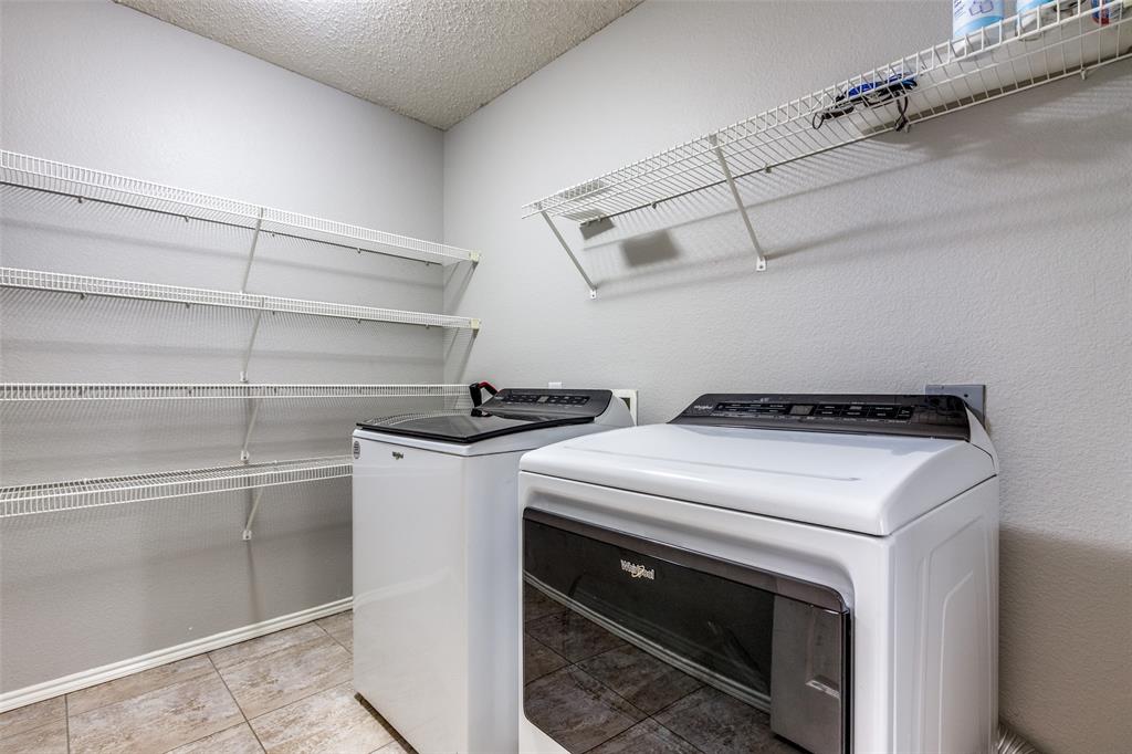 1425 Ridgecrest Drive Little Elm, TX 75068 - Photo 23 of 27 a utility room with dryer and washer