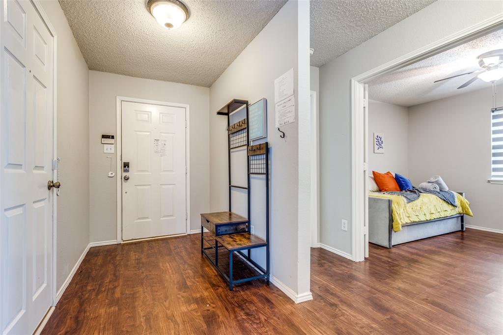 1425 Ridgecrest Drive Little Elm, TX 75068 - Photo 3 of 27 a view of an empty room and wooden floor