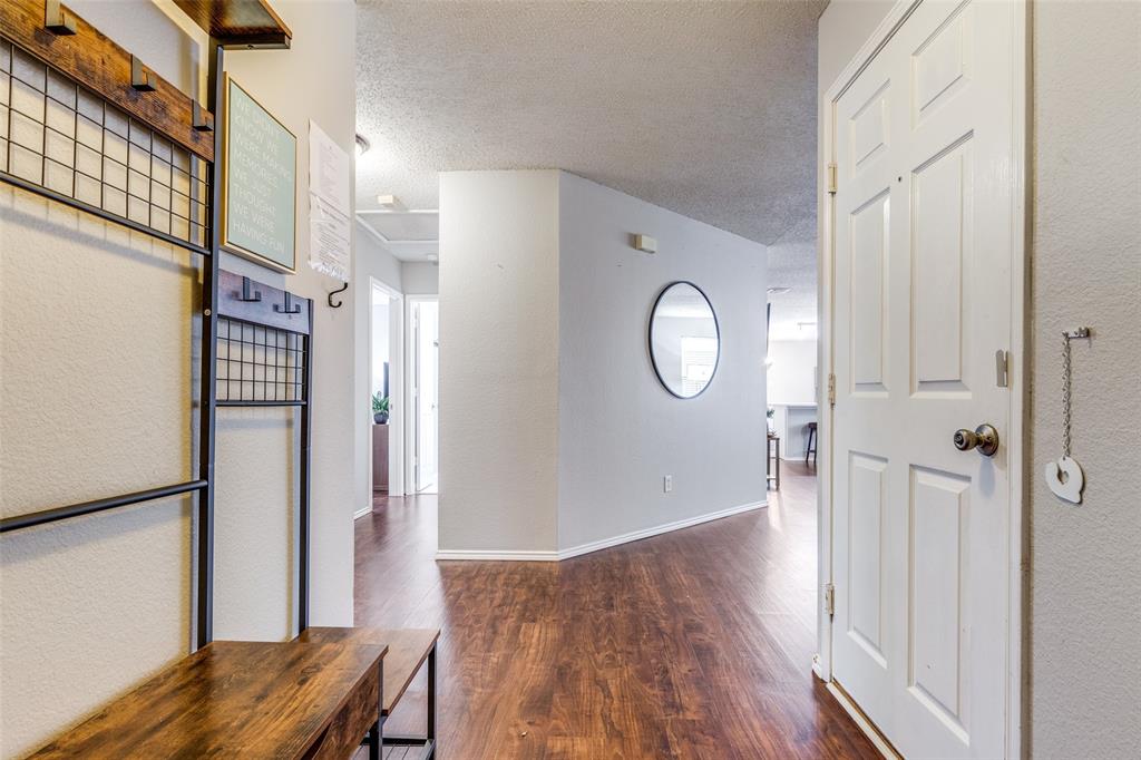 1425 Ridgecrest Drive Little Elm, TX 75068 - Photo 4 of 27 a view of a room with wooden floor and hallway