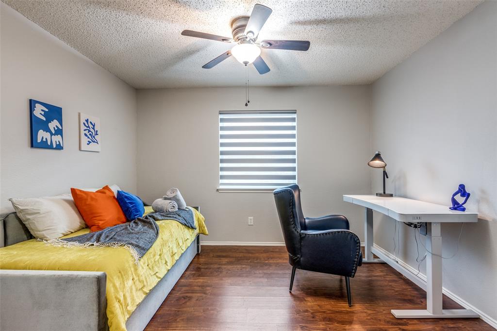 1425 Ridgecrest Drive Little Elm, TX 75068 - Photo 5 of 27 a bedroom with furniture and wooden floor