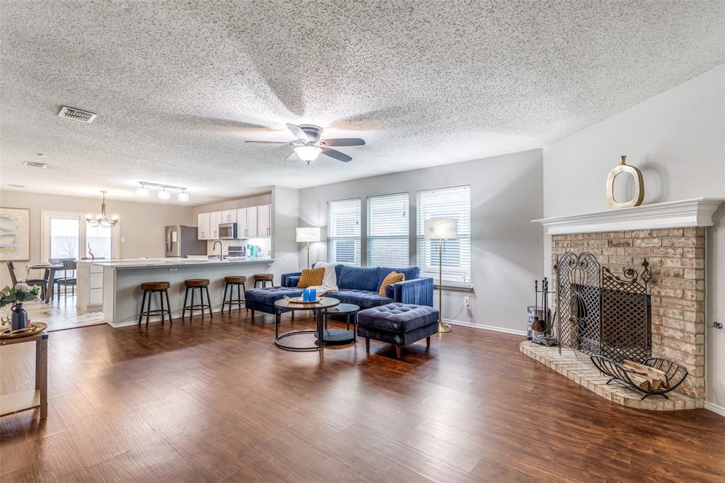 1425 Ridgecrest Drive Little Elm, TX 75068 - Photo 6 of 27 a living room with furniture and a fireplace