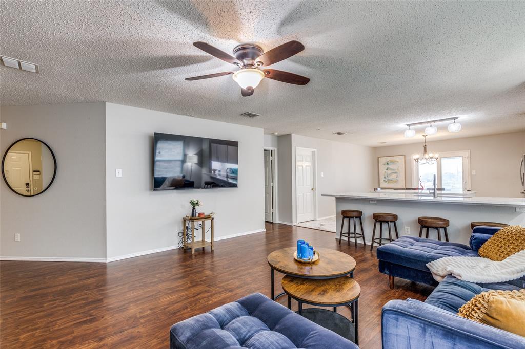 1425 Ridgecrest Drive Little Elm, TX 75068 - Photo 9 of 27 a living room with furniture and a wooden floor